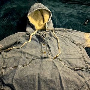 Sell O’Neiil denim hoodie with white design on sleeves. Snaps with drawstring.